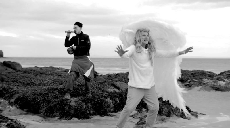 Bon Bon Walks Off Set!: Bon Bon in white wings on a rocky beach