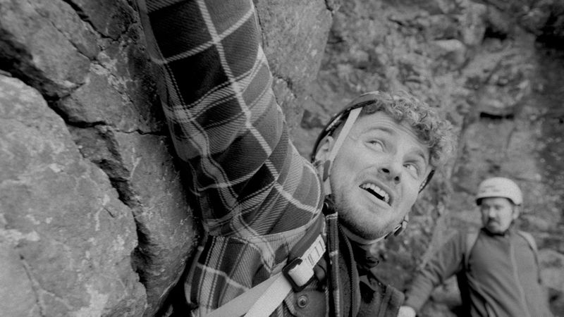 I Shoulda' Died!: Jacob mid-climb on a rock face