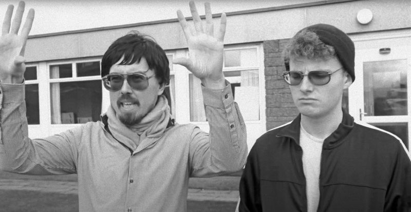 The Troon Revelations: two men in tinted glasses